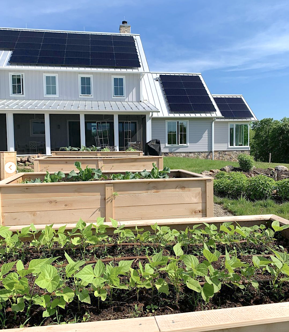 Raised garden beds in the backyard of Cold Brook Farm, a sustainable farmhouse in New Jersey