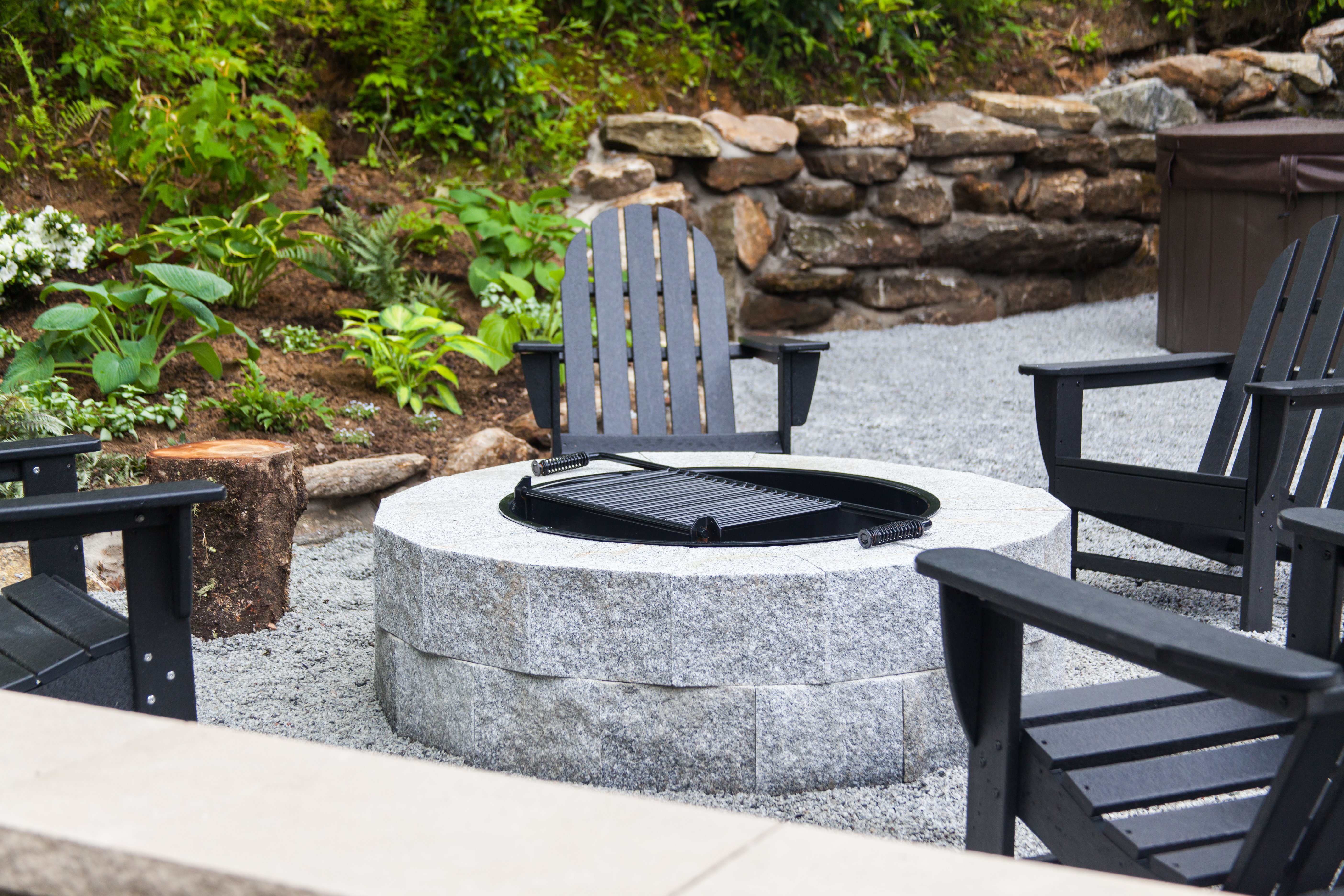 Eastern Gray DIY circular firepit and Adirondack chairs welcome the farm's guests 