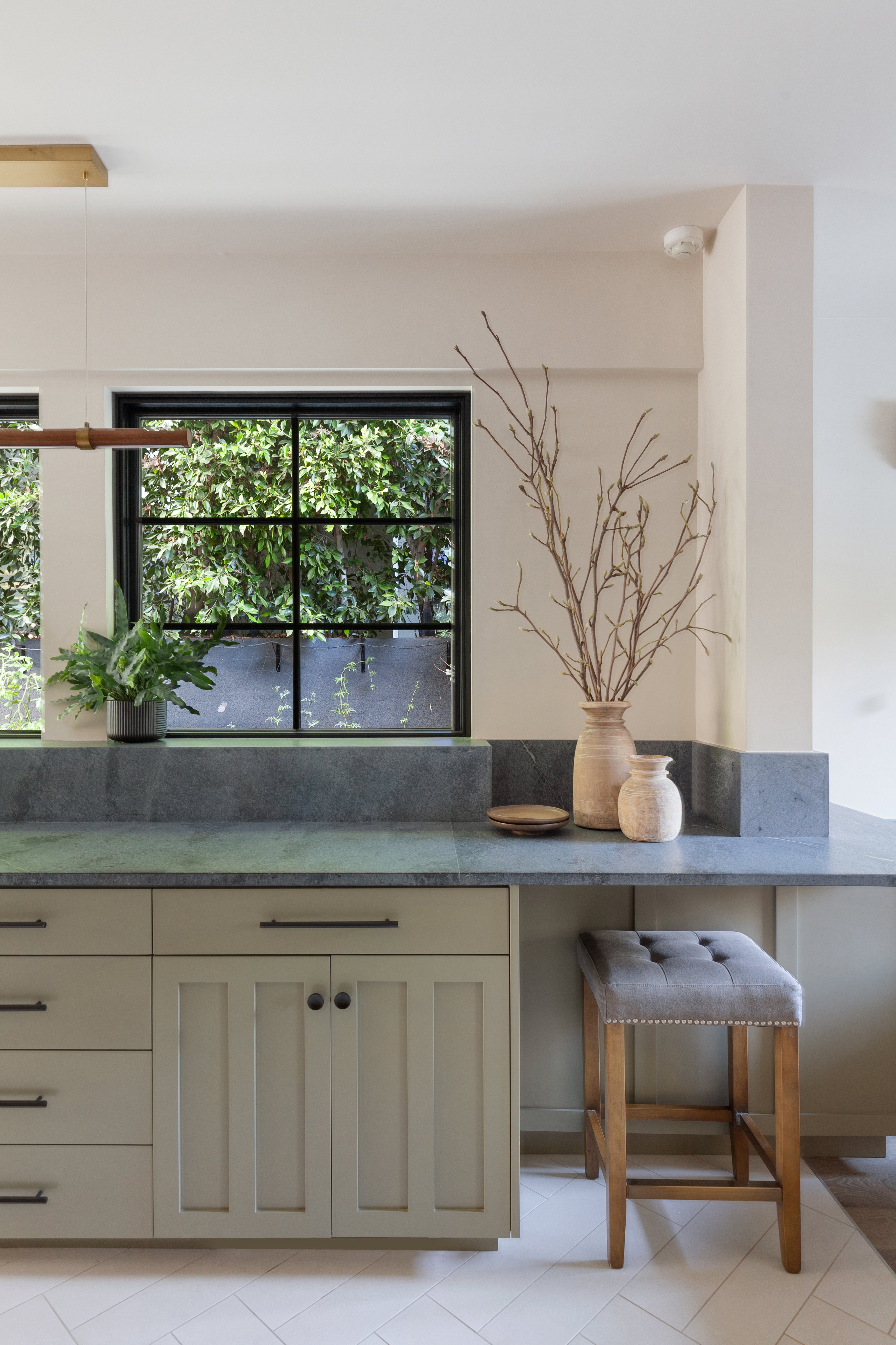 Grey Soapstone Countertops keep this LA kitchen light and bright